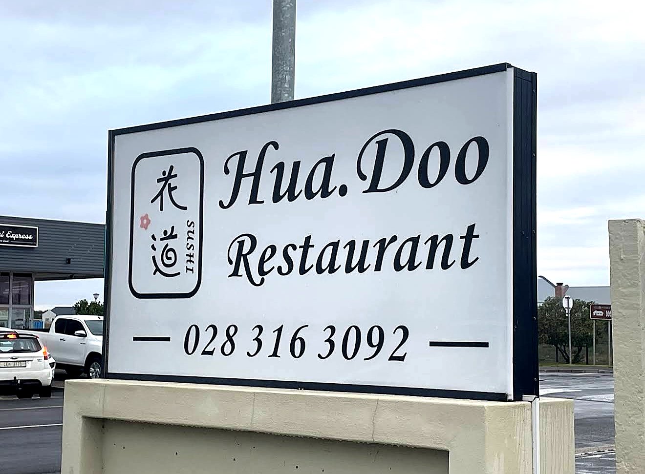 The Hua.Doo Restaurant sign on Main Road, Sandbaai